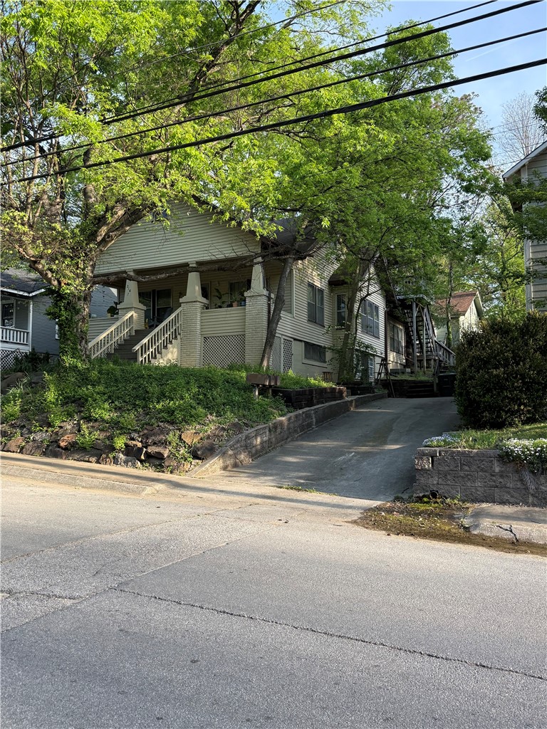 Fully leased and located just a block South of N College and three blocks from both Dickson Street and the Fayetteville Square this three unit apartment home is a tried and true downtown income producing property. Three unique units with large rooms, off street parking, and walkable to all things Fayetteville. All units are tenant occupied. Do not disturb tenants. All units will be made available to view once a pre-approved contract is in place.