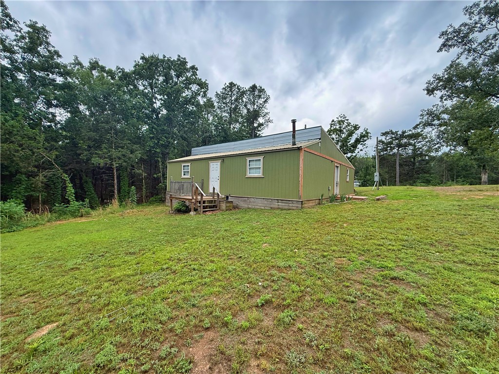 Nestled on approximately 3 peaceful acres this unique rural property offers privacy, nature, and endless outdoor adventure! Located near popular horse and riding trails, this property is perfect for those seeking a quiet country escape with room to roam. The home features 2 bedrooms with potential for a 3rd bedroom, 1 full bath, well water, and public water available at the street. Enjoy evenings overlooking the pond, or relax under the gazebo surrounded by serene country views. A storage shed provides additional space for tools, equipment, or outdoor gear. Level acreage offers plenty of room for animals, gardening, or recreation. If you’ve been searching for an affordable getaway, investment opportunity, or country homestead under $130K, this one is worth a look!