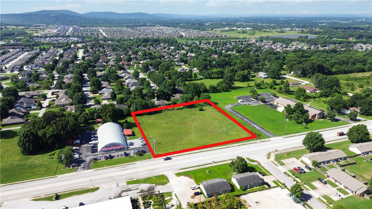 Prime 1.81+/- acre commercial lot on one of Fayetteville's busiest corridors! Located on highly visible Wedington Drive with traffic counts exceeding 25,000 vehicles per day and just minutes from I-49 with over 75,000 vehicles daily, this exceptional property offers outstanding exposure for your business or investment. Zoned C-1 Neighborhood Commercial, this site is designed to serve surrounding residential neighborhoods with convenience retail, restaurants, offices, medical, and personal service businesses. Flexible development standards providing excellent opportunities for a variety of commercial uses. Situated within the thriving Wedington Corridor, the property is surrounded by established neighborhoods, restaurants, grocery stores, fitness centers, retail, and close proximity to the University of Arkansas, creating a strong customer base and steady traffic. A rare opportunity to invest in one of Northwest Arkansas' fastest-growing commercial corridors!