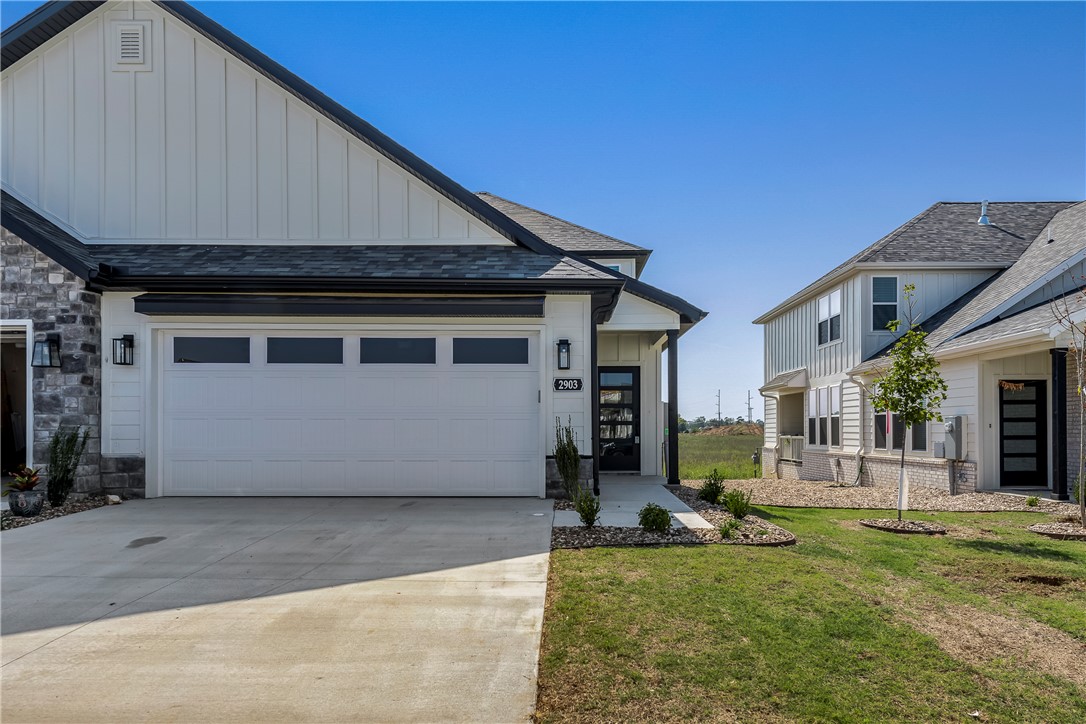This beautiful new construction townhome offers Great location close to Osage creek elementary and Creekside middle school, close to the new Creekside park, close to the trails at Bentonville, the neighborhood offers a dog park, Pickle ball courts and a pavilion. A short drive to Walmart general office. Come see this property in this new and up and coming area. Lawncare is providing by the owner!! , surrounded by a vibrant green landscape. Come inside to find an open concept floor plan complete with modern touches and finishes. The kitchen features stunning white cabinetry with matte black fixtures, a spacious center island, and sleek stainless steel appliances. With 3 beds, 2.5 baths, a 2-car garage, and a serene backyard view, this home is the perfect place to call home. Located minutes away from all the best Bentonville has to offer - don't miss out on making this townhome your new home! Schedule a showing today.