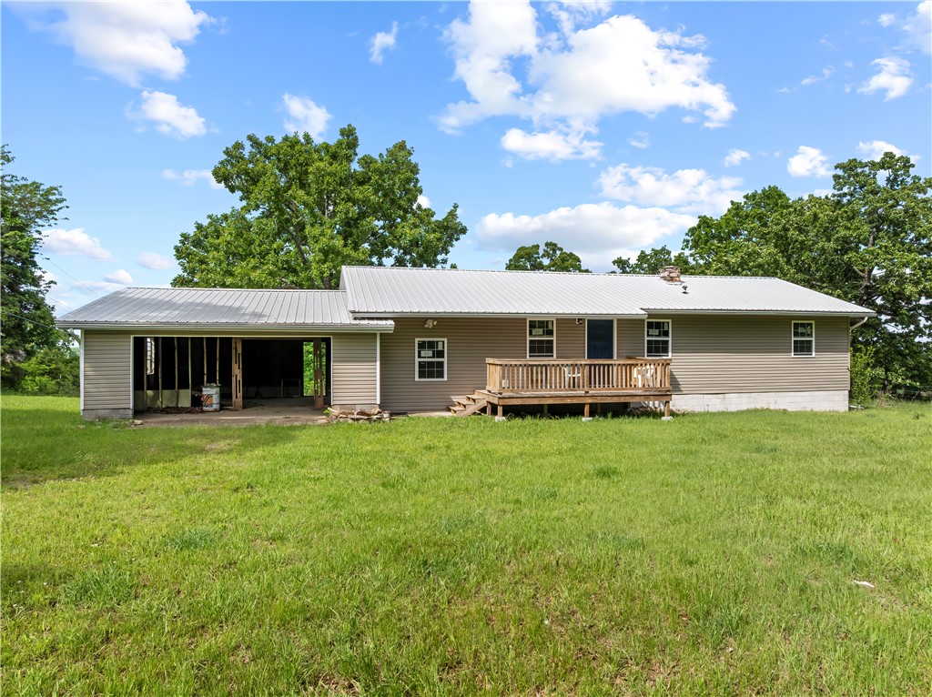 Looking for a place near Bull Shoals Lake where you can actually breathe?

This updated 3 bedroom, 2 bathroom home sits on 1.18 unrestricted acres just minutes from lake access—giving you the freedom to live, relax, & use your property the way you want.

Inside, you’ll find new flooring, fresh paint, updated lighting, new windows, & refreshed bathrooms. The layout is comfortable & functional, with natural light throughout & a kitchen that keeps everything within reach. A dedicated laundry area adds everyday convenience.

The full walk-out basement opens the door to whatever you need next—extra living space, game room, workshop, or storage for all your lake gear. With a bathroom area already in place, it’s set up for future expansion.

Outside, enjoy quiet mornings, open space, & room to spread out. The attached carport/workshop adds flexibility for hobbies or weekend projects.

Whether you’re looking for a full-time home, a weekend lake place, or something with room to grow—this one gives you options.