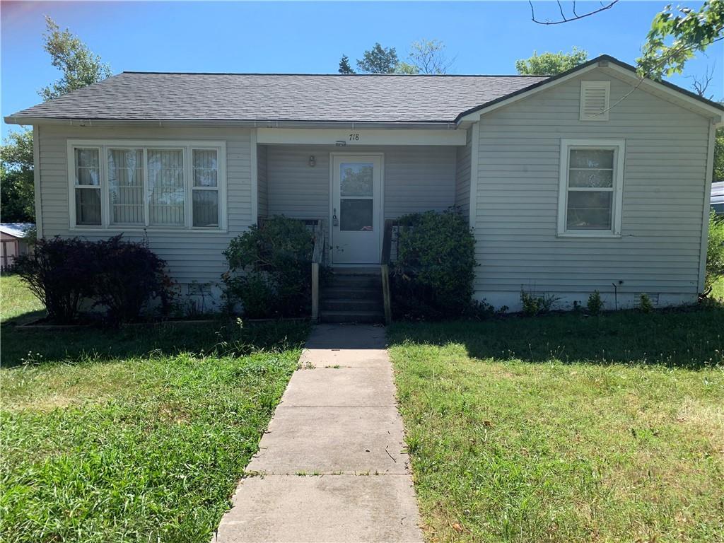 Ideal location just off the Main Highway through Berryville, this cute little two bed, 1 bath home would make a great starter home, rental, or investment. Large yard with storage building in the back. It also has a large separate laundry room. Roof shingles were replaced 2019