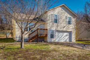 Perfect home for first-time home buyers.  Open floor plan with plenty of kitchen storage and stainless steel appliances.  Living room and kitchen have a vaulted ceiling to add to the open feel.   Back yard is fenced and spacious.  Bathroom has recent updates.  An extra room has been enclosed behind the basement for an extra family room.  One car garage.