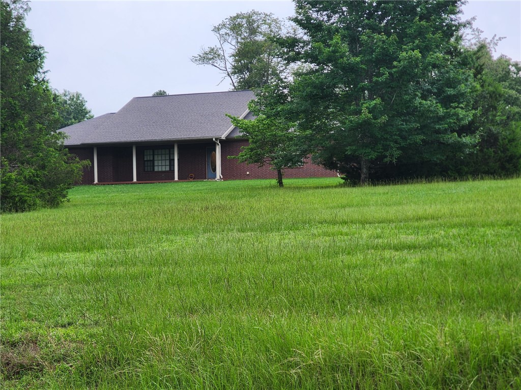 Spacious 3BR/2BA Brick Home on CR 3348!
Enjoy the best of Arkansas country living in this solid, all-brick 1,800 sq. ft. home located just north of Clarksville. Featuring a highly desirable 3-bedroom, 2-bathroom floor plan, this property delivers excellent curb appeal and functionality. Highlights include a generous 3-car attached garage, central heating/air, tile and carpet flooring, and a beautiful, park-like view from the property. Situated in a peaceful country setting close to scenic Lake Ludwig, yet under 10 minutes to local schools, shopping, and I-40 access. A fantastic opportunity for buyers seeking comfort, durability, and a serene location.