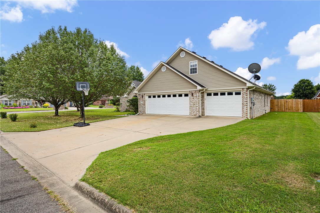 Luxury meets functionality in this extensively remodeled 5-bedroom, 2.5-bath home offering 2,876 sq. ft. of beautifully updated living space on a desirable corner lot in Stewart Place. Homes with this combination of size, quality, and modern finishes rarely become available in Clarksville.

Step inside to soaring vaulted ceilings with exposed wood beams, abundant natural light, and an open-concept design centered around a custom entertainment wall with an electric fireplace. The stunning kitchen features quartz countertops, an oversized island, stainless steel appliances, extensive cabinetry with soft-close drawers, and premium finishes throughout.

The spacious primary suite offers a beautifully renovated bath with a tiled walk-in shower and soaking tub. Upstairs provides additional living space with endless flexibility for family, guests, hobbies, or a home office. Outside, enjoy a covered patio, privacy-fenced backyard, storm shelter, and 3-car garage. Refrigerator conveys. Truly move-in ready.