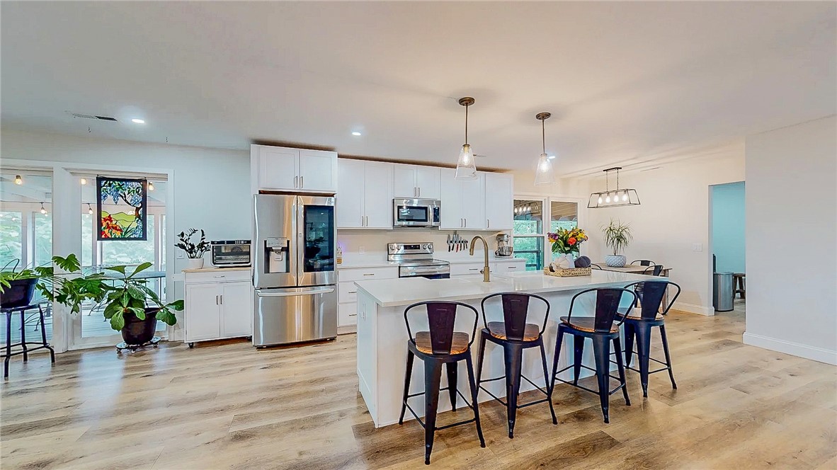 2 Acres with a Fully Remodeled Home!
This one-of-a-kind property won’t last long! Nestled on 2 peaceful acres, it offers quiet living with Arkansas wildlife right in your own backyard.
The main level features 2,009 sq. ft. of beautifully remodeled living space, fully updated in 2023. Recent upgrades include a new water heater (2023) and furnace (2024). The basement provides 1,318 sq. ft. of finished space with heating and air, plus an additional 326 sq. ft. unfinished—perfect for storage. Whether you envision a man cave, extra bedrooms, or a custom entertainment area, the possibilities are endless.
Step out back to a spacious deck with both open-air and screened-in sections—ideal for morning coffee or evening sunsets. Don’t miss your chance to own this true slice of tranquility!  Seller offering $5,000 Flex Cash. 1% lender credit offered from preferred lender.