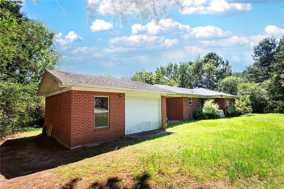 8.38 Acres with Endless Possibilities!
Enjoy the perfect combination of privacy and convenience on this beautiful 8.38-acre property. The brick home features a new roof and updated heating and air system, offering peace of mind for years to come.
Additional improvements include both a carport and garage, providing ample space for vehicles, equipment, or storage. Whether you're looking for room to expand, start a hobby farm, build additional structures, or simply enjoy the open space, this property offers countless possibilities.
Experience country living with the benefit of being just minutes from all the shopping, dining, schools, and amenities the city has to offer.