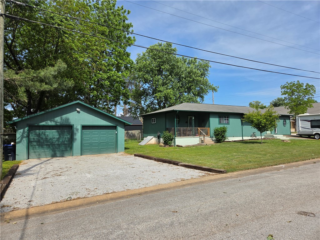 Beautifully updated and well maintained home with potential for multiple uses. This home can be a 3 bedroom, 2 bath, home or a 2 bed, 1 bath, with an efficiency apartment for a rental, or family member that needs their own separate space. Conveniently located just a short distance to restaurants, gyms, shops, grocery stores, and more!  A corner lot, fenced back yard, deck & covered porch, storm shelter, and detached two car garage are just some of the great points of this jewel.