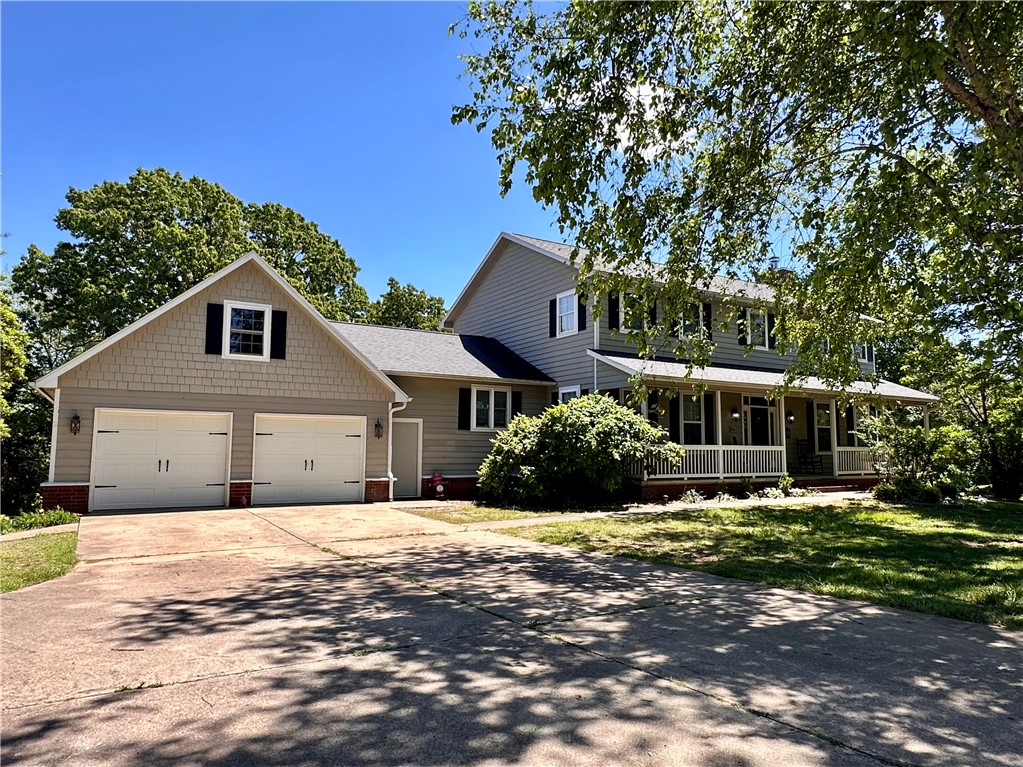 Rare Fayetteville opportunity offering true multi-generational living in Ridgemont Estates. This 4,500 SF home on 1.57 acres includes a private lower-level living suite with full kitchen, 2 bedrooms, bath, laundry, and separate drive around no-stair entry - perfect for parents, college students, guests, or flexible family living. Updated 6BR/4BA home on large lot in East Fayetteville balances privacy with close-to-town convenience. The main floor boasts refinished hardwood floors and a renovated kitchen complete with a new island, countertops, soft-close hinges, and farmhouse sink. Plus, a sunken family room with fireplace and plenty of natural light, a dedicated flex room featuring 360-degree, floor-to-ceiling built-in bookshelves, and office with Murphy bed. Upstairs, the primary suite offers a peaceful retreat with an updated en suite bath, remodeled shower, and new flooring along with 3 bedrooms and shared bath.  Don't miss this unique opportunity to enjoy room to grow in a private, established setting!