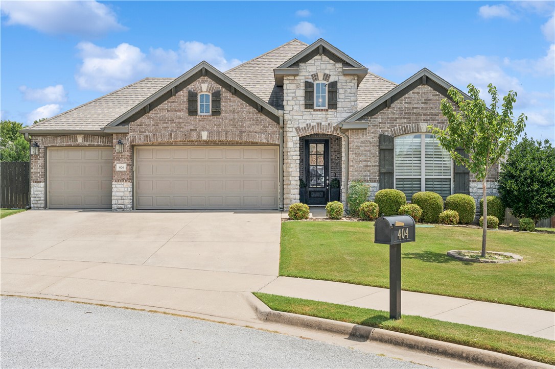 Welcome to 404 Orchard Circle in the Brentwood Subdivision of Cave Springs! This well-maintained home offers 3 bedrooms, 2 full baths, and a spacious 3 car garage. A large inviting living room is complimented by a floor-to-ceiling stone fireplace, and built-in surround sound. The open concept kitchen features granite countertops, a large island, and a walk-in pantry, making it ideal for everyday living and entertaining. The primary suite includes a large walk-in closet and a huge, oversized double-head walk-in shower. Outside, enjoy a covered patio with an outlet for an outdoor TV and a large, flat backyard complete with a playset and storage shed that convey. Located on a quiet cul-de-sac, the home is just a short walk to the neighborhood pool and park. Conveniently located in the Rogers School District, this home has it all! Combining thoughtful upgrades, functional living spaces, and a great neighborhood in one of Northwest Arkansas's most desirable communities.