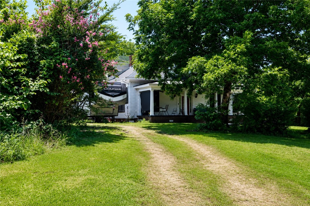 Escape to space, privacy, and comfort in this beautifully maintained 2-story home offering 2,900 square feet just outside city limits. Downstairs greets you with soaring 11-foot ceilings and a warm, inviting flow between the formal living room, formal dining room, and formal office — perfect for both everyday living and entertaining.
A spacious mud room with attached laundry and a full bathroom adds everyday convenience, while the cozy fireplace brings character to the living space. All-new windows throughout the home enhance energy efficiency and natural light, and comfort is covered year-round with a full HVAC system plus mini-split units for added flexibility.
Outside, enjoy your own stocked fishing pond, an RV hookup for guests or hobbies, and the peace of mind of a storm shelter. Fiber optic internet keeps you connected, even with all this room to breathe. The home was thoughtfully remodeled in 2007.
A rare combination of space, function, and tranquility — schedule your showing today.
Moore & Co. Realtors