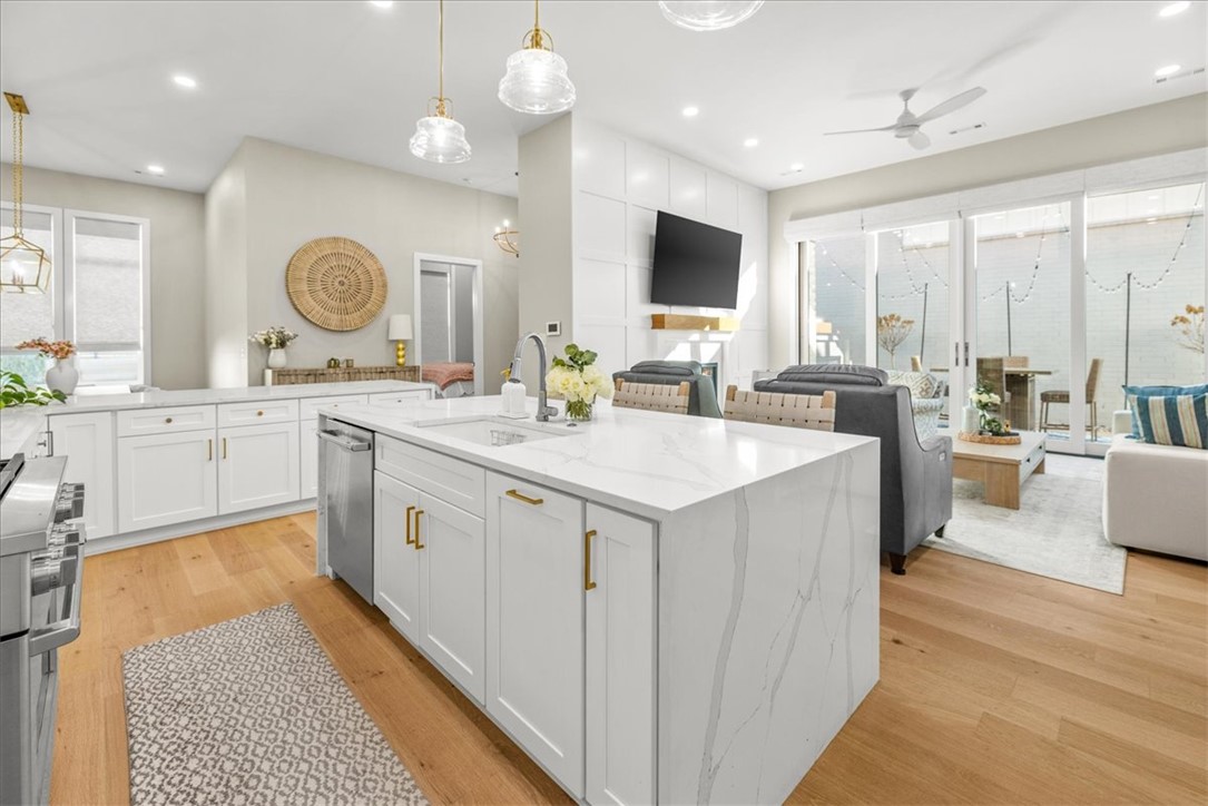 Tucked in the desirable Harmony neighborhood within the Aurora community, this 2,163 sq ft garden home offers 2 bedrooms and 2.5 baths with a well-designed, open layout. Natural light fills the living spaces, highlighting clean lines and thoughtful details throughout. The kitchen features quartz countertops, a striking waterfall island, and abundant storage—perfect for both everyday living and entertaining. The spacious primary suite offers a true retreat, complete with a luxurious, spa-like bath and an oversized walk-in closet. Enjoy low-maintenance living with HOA-covered internet, lawn care, and courtyard maintenance. Community amenities include two pools, clubhouse, playground, dog park, bike repair station, fitness course, and basketball/pickleball court. Convenient Bentonville location with easy access to I-49, shopping, and dining.