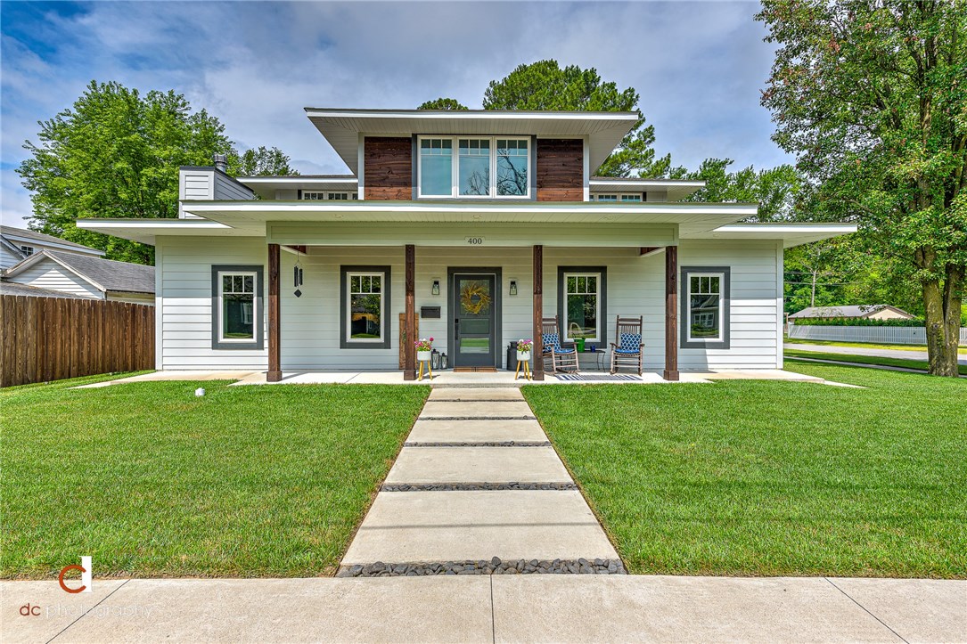 Downtown Bentonville Dream Home. Beautifully designed and detailed, this 2017 custom built home is on the perfect .25 acre, corner lot. Home is 3492 SF (4 bd/3.5ba) + 840 SF (1bd/1ba) income producing apartment over the attached, oversized 3 car garage. Very energy efficient with 12 in. ICF first floor exterior walls, complete foam insulation, Windsor casement windows, Fujitsu mini-split HVAC systems, whole house ERV system, gas tankless water heater, and all LED lighting. Abundance of storage and built-ins, including a built-in bar with wine rack & fridge. Upstairs has a laundry closet, in addition to massive laundry room downstairs. 5 in. wide white oak hardwood floors downstairs, quartz counters throughout, custom cabinets, 36-in. commercial grade Blue Star gas range & hood, 12'x8' Windsor wood clad sliding glass door to patio. Outdoor patio has string lights, built-in fire pit, gas grill hookup, 4 raised wooden garden beds, and an outdoor shower. 1/2 mile walk to everything downtown! This home is a must see!
