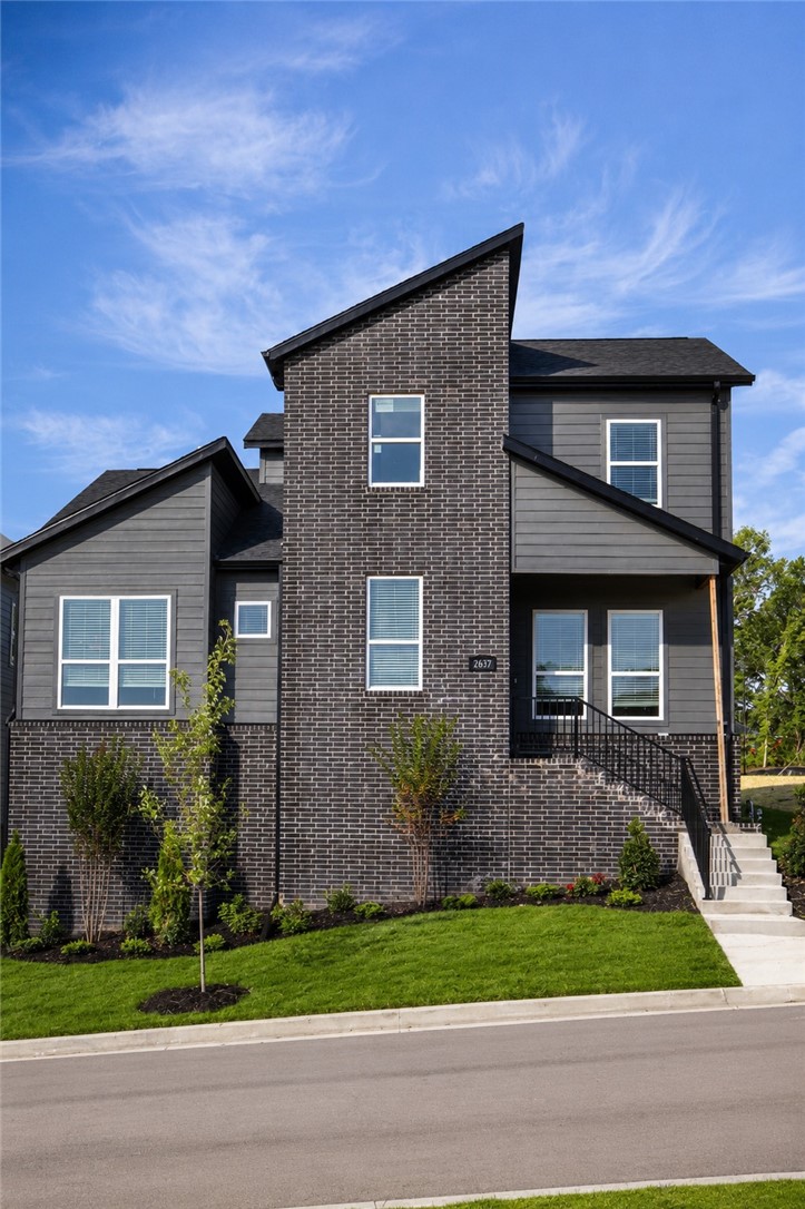 Discover The Ewan in Livingston — a beautifully designed new construction home by Brittenum Residential in Fayetteville. Offering 1,950 sq. ft., this thoughtfully planned home features 3 bedrooms, 2.5 baths, and a 2-car garage. The open main level stands out with 10' ceilings, hardwood floors, a spacious great room with fireplace, and a stylish kitchen with Frigidaire Professional stainless steel appliances. The dining area features a decorative trim wall, while the main-level primary suite feels like a private retreat with stained beams, a walk-in closet, and a freestanding tub. Upstairs, two additional bedrooms, a full bath, and a loft provide flexible space for guests, work, or play. Enjoy maintenance-free living with a covered front porch and covered back patio, all in a connected Fayetteville location near parks, trails, dining, Downtown Fayetteville, the University of Arkansas, and everyday conveniences. Ask about our current incentives!