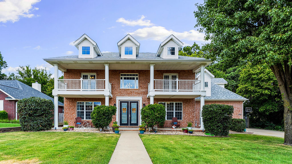 Welcome home to this stunning 2-story Georgian brick beauty in Bentonville's sought-after Sturbridge subdivision. With 5 bedrooms, 3 full baths, and 2,708 square feet of thoughtfully designed living space, this home offers room for everyone. The main level features a dedicated library/study/office, formal dining room, and spacious family room warmed by a gas log fireplace. The kitchen shines with quartz counters and stainless appliances, while upstairs you'll find a private primary suite with a whirlpool tub and walk-in closet. Enjoy morning coffee on the deck or patio overlooking the professionally landscaped, wooded backyard. Prime location just minutes from Coler Mountain Bike Preserve, downtown Bentonville, Walmart Home Office, shopping, and schools. Quality craftsmanship, quiet charm, and unbeatable convenience — this one has it all!
