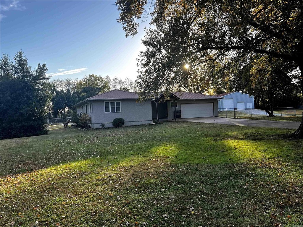 Location, location, location! If you are looking for the perfect homestead, look no further; this awesome, completely renovated gem has it all with 3 beds 2 baths on 1.65 acres of very private, and fenced property.  The home is situated at the end of a private culdesac and is less than 3 miles from downtown Bentonville square.  It features an in ground pool, a massive 40x50 insulated steel shop with RV hookups.  Minutes away from Osage park and Coler bike trails. Come home!