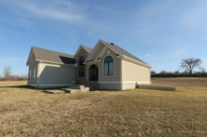 This beautiful home with gleaming Italian tile floors to the heavy custom iron door, 2 fireplaces, safe room, surround sound inside and outside large attic floored for storage,Central heat and air upstairs and down plumbing and electrical in basement just needs sheet rock and fixtures.13x13 concrete safe room FEMA approved with 7 1/2 walls with steel20X20 additional concrete pad .....this home is ready for YOU