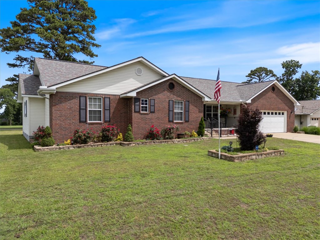 Beautifully updated lake area home in picturesque Holiday Island. This bright and airy home features brand new engineered hardwood floors & all new carpet. A seamless floor plan leads you through a large & spacious living area, complete with a wood pellet stove for added winter warmth & security, an open & inviting kitchen with tons of cabinets and ample granite countertop space, a breakfast bar & dedicated formal dining area, spacious guest bedrooms, a very large primary suite with en suite bathroom and large walk in closet. Prepare yourself for breathtaking views from the screened in back porch of the golf course and lush landscape. Ideal space for relaxing or entertaining friends & family. Huge 3 car garage will fit lake toys, car, truck, motorcycle & there is even a golf cart exit directly on to the course in the back yard. Holiday Island offers an impressive range of amenities, including a community pool, pickle ball/tennis courts, playground, 18 & 9 hole golf courses. Lot next door is also listed​​‌​​​​‌​‌​​​‌‌​​​‌‌‌​​‌​​‌‌​​​​ MLS#1341934