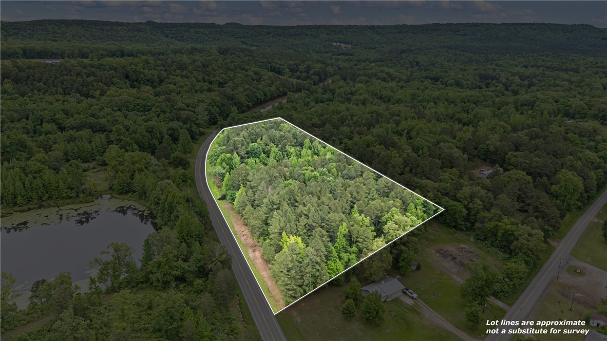 Looking for the perfect place to build, camp, or invest in the Arkansas Ozarks? This 6.53 +/- acre tract of mostly pine trees offers approximately 300 yards of Highway 7 North frontage just north of the Highway 7 and Broomfield Road intersection. Public water is at the street & electricity / fiber internet are also available, making it a great spot for a future home, cabin, or weekend getaway.

One of the best things about this property is its location. Outdoor enthusiasts will appreciate being just minutes from some of the area's most popular destinations, including the Ozark National Forest, Mack's Pines Recreation Area, Moccasin Gap, Big Piney Creek, Long Pool Recreation Area, and countless miles of hiking, hunting, fishing, floating, ATV & horseback riding opportunities. Whether you're chasing trophy deer, exploring scenic mountain roads, or spending weekends on the water, adventure is never far away. All while being just 7 minutes to downtown Dover and 20 minutes to Russellville!