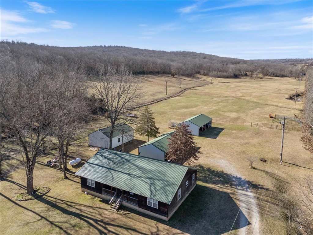 Approximately 44.8 acres situated on a paved road offer the perfect blend of privacy and accessibility. A charming stand of woods conceals this secluded farm, opening into a lush valley meadow bordered by mature trees and a year-round gently flowing stream that owners use to water garden. A large pond rests near the far end of the pasture, enhancing the property’s natural beauty and utility. The farm features a well-built, quality home equipped with new heating and air conditioning, complemented by a substantial wood-burning stove capable of heating the entire residence. Additional improvements include two 4 bay carports and a newly constructed 30’ x 40’ heated workshop with electric & concrete floor, providing exceptional space for equipment, hobbies, or agricultural use.
All appliances convey. Furniture may be purchased separately.