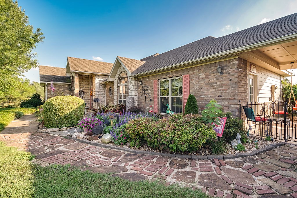 Horse farm, hobby farm, car enthusiast, so much potential!!!
Less than 10 miles from WMHO. 
A truly must see property set on 5 acres (all fenced), this 2,395 sq/ft home features 4 bedrooms, 3.5 baths, a 12x30 sunroom, wood burning fireplace, a 3,500 sq/ft shop & barn with horse stalls, 1,200 sq/ft extra garage(total of 11 spaces for cars) & a recently upgraded in ground pool. 
Bentonville schools