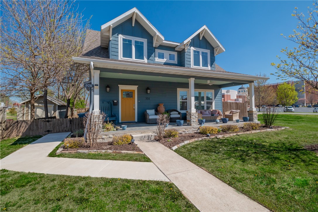 Enjoy the best of Downtown Bentonville Living in this Craftsman-Style Home on large lot! Just 1 block from the Bentonville Square, this urban style farmhouse boasts highly desired open concept living design capturing the perfect blend of old charm and modern new features.  Built in 2017, this 4-bedroom, 2.5-bathroom home features an open layout with wooden beams, quartz countertops throughout, gas cook-top, custom lighting, wainscotting, built-ins & more.  Main level features two large Living Rooms, eat-in kitchen with island, large laundry/mud room with sink. Upstairs is very private with primary suite and bathroom with an additional 3 bedrooms and bathroom! Enjoy the serenity of your private back yard perfect for entertaining with pergola and green space with hard to find large 3 car detached garage. Only a minute walk to Downtown Bentonville square to enjoy all the entertainment, dining, shopping, trails and more. Bentonville Schools