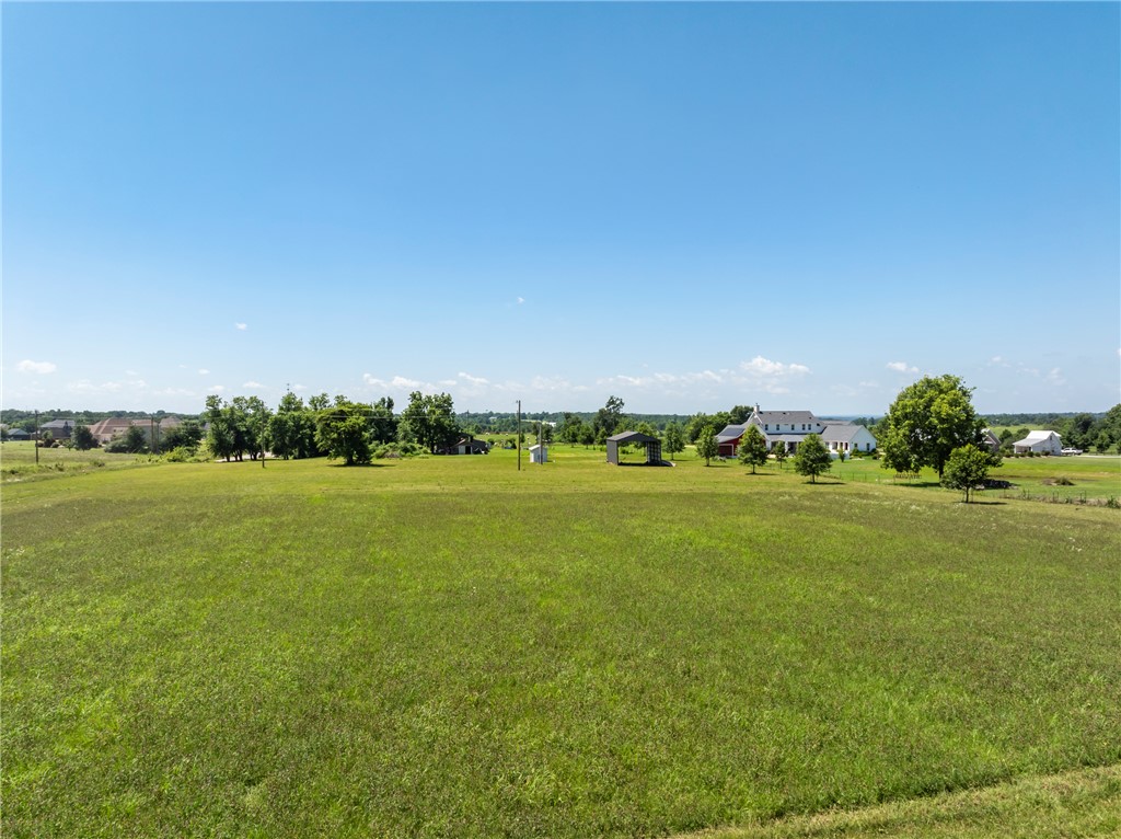 Attention developers, investors or someone looking for their dream estate. This 4.11 acre parcel located in a highly sought-after location close to everything from XNA, Creeks Golf Course, Pinnacle Hills and a short drive to Interstate-49. It's only a half mile drive to Hwy 264 for your convenience. Great opportunity  to be close to everything while still enjoying a peaceful rural country setting. It's ideal for building your dream Estate with room for a large shop, having a small farm or development potential. It has gas and electric at the street.  Located in city limits of Bentonville and Bentonville school district.