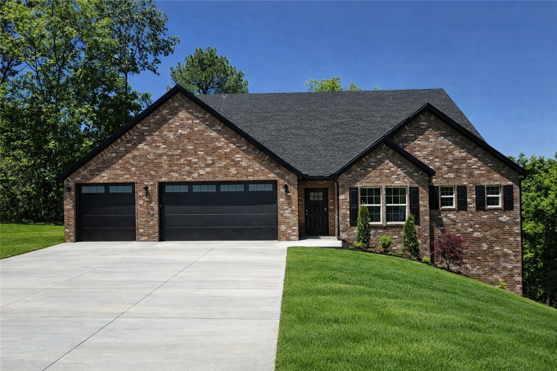 Stunning 2890 sq ft all brick home on a private .47 acre lot at the end of a cul-de-sac with a seasonal view overlooking Loch Lomond. 4 Beds (3 on main floor) + a bonus, a pocket office, 3 and a half baths, and a luxurious primary suite with direct deck access, a freestanding tub, and an expansive bath. A vast open living/dining/kitchen with vaulted ceilings, a fireplace, quartz counters, and high-end finishes. A 52' long X 12' deep rear deck with a 20X12 covered area, great for outdoor gatherings. The 3-car garage connects the mudroom and pantry, with Pella windows and tasteful designer details and Fridgidaire Gallery appliances. Preferred Lender Credit of 1% of loan amount up to a maximum of $3,000.