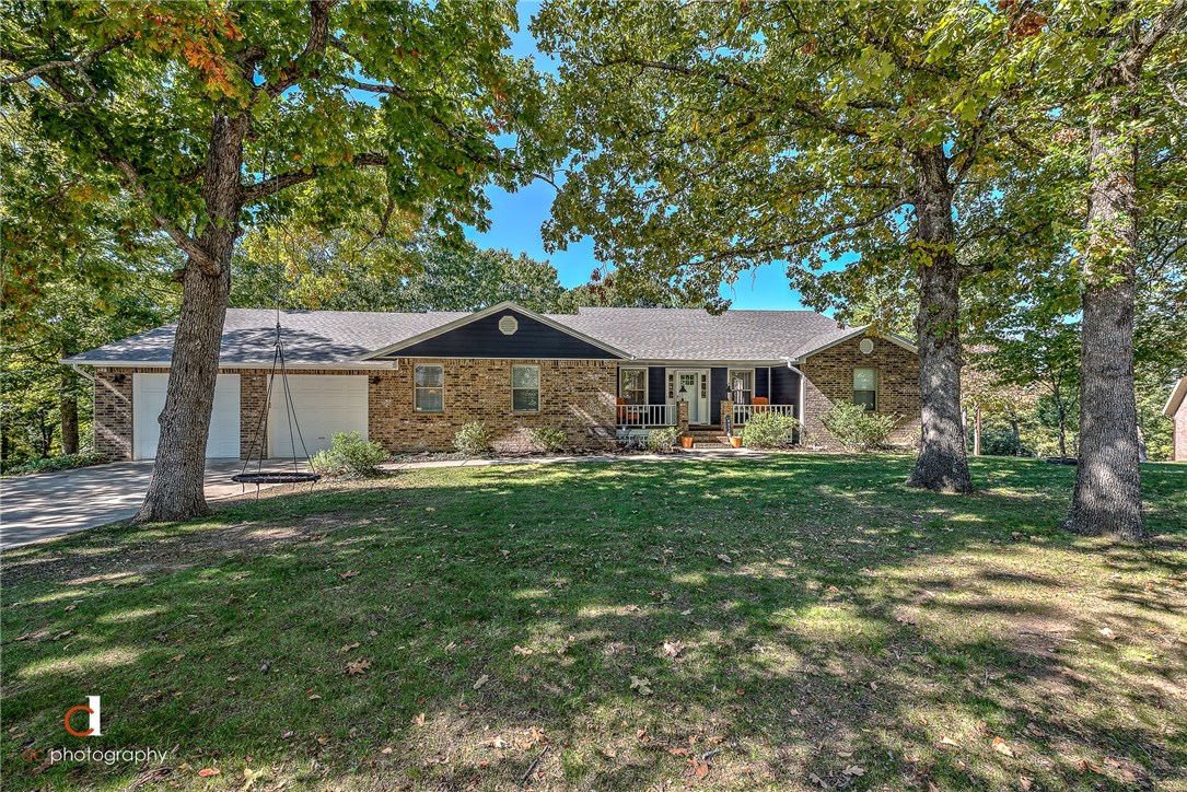 Beautifully remodeled home within a quick walk to Beaver Lake and only 12 mins from downtown Rogers.This 4 bed 3 full bath home features a downstairs bonus room, outside 2nd story deck, an over-sized 34'x25' garage. Garage is deep enough to fit four cars or possibly a boat and car in same bay. Home has updated electrical & plumbing, HVAC is less than two years old, and a new roof this year. Tons of exterior & interior storage.Boat slip permit possible for area. Watch video vimeo.com/297007073
