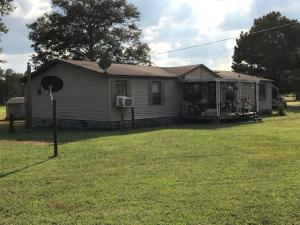 All appliances convey and possible owner financing available on this Three bedroom 2 bath doublewide sitting on approx. 3.17 acres.  Nice rural lot.Needs some updating.