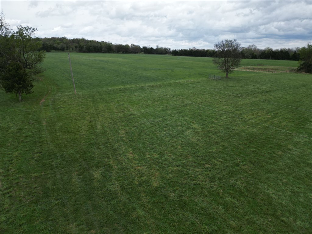 This 120-acre m/l working cattle farm located off of Rally Hill Road just outside of Valley Springs, Arkansas offers a well-balanced combination of productivity and potential. The property is fully fenced and cross-fenced, making it ideal for efficient livestock management and rotational grazing. A strong water well producing approximately 100 gallons per minute provides a reliable water source, complemented by four ponds and automatic waters strategically located across the acreage. Currently supporting 50 head of cattle, the farm also features a productive hay field yielding around 400 round bales annually providing both sustainability and income potential. From one of the highest points on the property, you’ll find a stunning homesite offering panoramic views of the surrounding countryside perfect for building your dream home. With county road frontage on two sides, this property not only excels as a working farm but also offers excellent development potential for future investment opportunities.