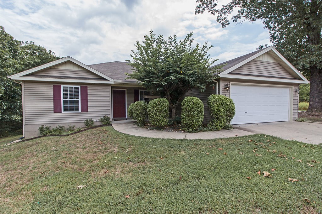 Nice looking home on a fantastic corner lot. This split floor plan home has a very nice size nearly level fenced-in back yard. Master has double vanity,whirlpool tub and separate shower. Living room has one year-old bamboo flooring and high ceiling so you can hang your favorite picture above the fireplace. Bedrooms all have newer carpet about 2 yrs old. Kitchen layout is open with window above the kitchen sink. Range is 2 years old. It's a must see! Home is in an RD Location.