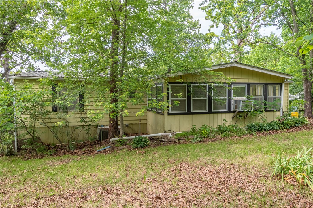 Discover the perfect Ozark retreat in Tucker Hollow! This property features a comfortable 1,200 sq ft mobile home with a warm, functional layout — ideal for full-time living or a weekend getaway. Enjoy the peaceful surroundings of the Arkansas Ozarks with nature at your doorstep and plenty of room to roam.

The deal gets even better — included is a spacious 28x32 ft shop located directly across the road, perfect for a workshop, equipment storage, or hobby space. Whether you're a hobbyist, outdoorsman, or contractor, this shop adds tremendous value and versatility to the package.

Situated just minutes from the stunning Bull Shoals Lake, enjoy world-class fishing, boating, and year-round outdoor recreation. Lead Hill schools, churches, and everyday conveniences are all within easy reach.

Home AND shop — this is a rare opportunity at an incredible price point. Don't let it pass you by. Call today!