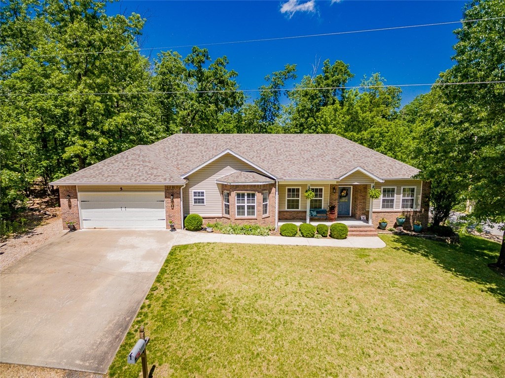 Entertain family & friends in this pristine one level home offering 2,158 sf, 3 bedrooms, 2.5 baths. Split bedroom plan, large & comfortable master suite, corner gas log fireplace & cathedral ceiling, roomy & private guest bedrooms. Large laundry provides storage, pantry & powder room conveniently located off the garage. The outdoor living areas offer a screened patio, open deck/dance floor, firepit patio, hot tub & the 24 x 12 x 4 above ground swimming pool with new liner is an amazing party area. WOW!