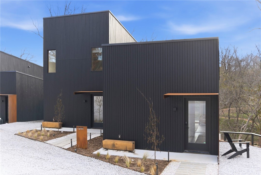 Modern creekside cabins just 1 mile from Bentonville Square! Perfect for investors, corporate buyers, or young professionals seeking downtown access with the ability to offset cost of living. Each parcel includes 2 dwellings (6 total across 3 lots / 0.58 acres) backing up to Black Apple Creek with waterfall and trail views. R-2 zoning with new sewer and utilities, shared access drive. Suite 1: 376 SF studio 1 bath. Suite 2: 892 SF 2 bed 1.5 bath. High-end finishes include cedar rainscreen, concrete floors, stainless appliances, and high-efficiency cassette mini-splits. Buy one parcel or all three at a portfolio discount. Buyer to verify all details.