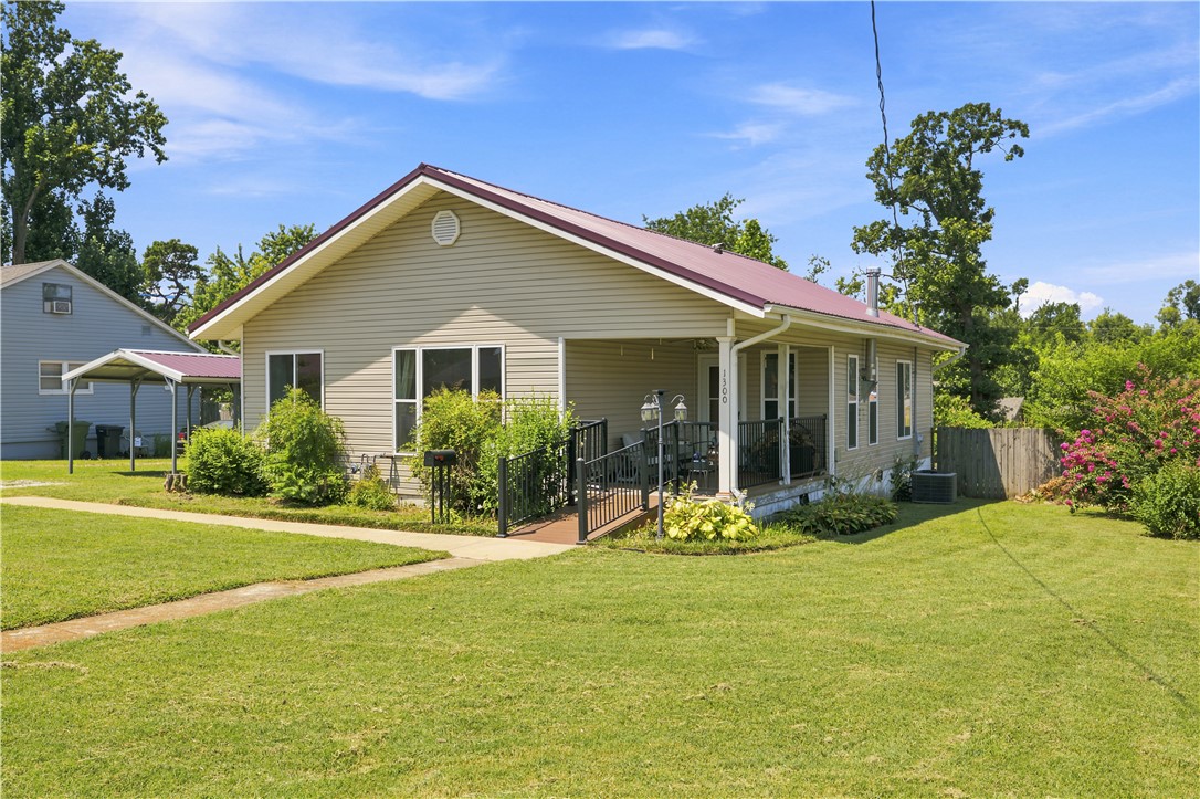 Bring your vision and make this home your own! Full of potential, this property is ready for a little TLC to restore its charm. Inside you'll find woods floors, a spacious living room & an additional sitting room that provides flexible space for relaxing. The kitchen offers an abundance of cabinet storage making organization a breeze. Metal roof approximately 14 yrs old adds lasting value and durability.  Outside enjoy a large yard with plenty of room for gardening, play or outdoor gatherings with a gazebo to sit under in the evening and relax. Whether your looking for your next home or an  investment opportunity this property is packed with possibilities and waiting for your personal touch. Seller related to a licensed agent.