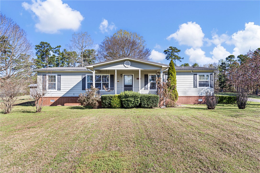 Discover the perfect blend of privacy, land, and convenience with this home on 27 beautiful acres featuring a stocked pond ready for fishing. This nearly 1,800 sq ft home offers a comfortable layout with a spacious living area and a kitchen complete with granite countertops, ideal for everyday living and entertaining. Large windows invite natural light and provide peaceful views of the water and surrounding acreage.

Step outside to enjoy endless possibilities—room for a garden, hobby farm, recreation, or simply relaxing in your own private setting. The land offers a mix of open space and natural beauty, making it ideal for those seeking a quieter lifestyle with space to grow.

Washer & Dryer and 2 Refrigerators Convey!!