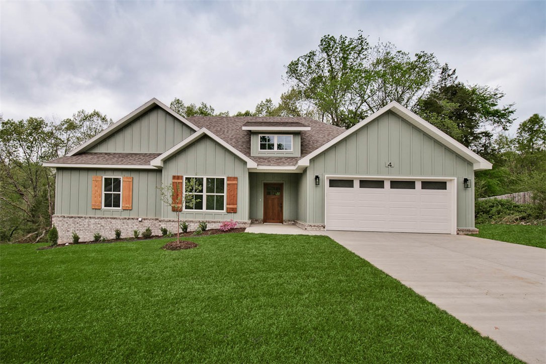 New construction on a flat wooded lot! Located down the street from the Lake Loch Lomond boat launch and Highlands Golf Course! Easy access to I-49! Step inside to discover an inviting open concept design featuring beautiful floors that enhance the spacious feel of the home. NO CARPET! 2 bedrooms + office. The stylish kitchen is equipped with a gas range, premium black stainless steel appliances, 3 cm quartz countertops, custom cabinets, and a walk-in pantry. Entertain or unwind in the living area, complete with a stunning fireplace, or step out onto the HUGE COVERED DECK to enjoy the peaceful surroundings. The primary suite features a large walk-in tile shower! Buyer can receive $3,500 in closing costs when using the builder's preferred lender!