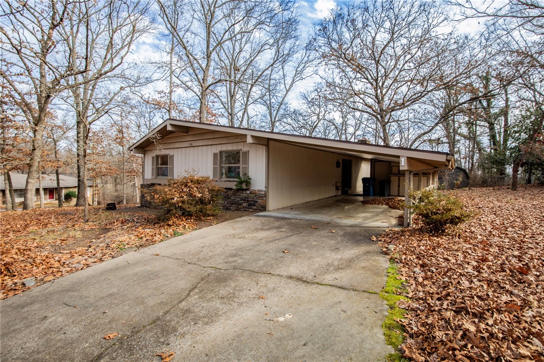 Walk to an Arkansas beach from your own home! Lake Avalon’s beautiful beach is just 0.7 miles away from this charming two-bed, two-bath property. Perfect for a small family or an excellent opportunity for a short-term rental investment, this home offers both comfort and versatility. Home is 0.4 mile from Bamboozled Mountain Bike Trail access.

Enjoy cozy evenings by the wood-burning fireplace or entertain guests on the spacious back porch. Experience all that Bella Vista has to offer—expansive mountain-biking and walking trails, multiple golf courses, and plenty of opportunities for boating and fishing with nearby lakes and parks.

Located in the highly regarded Bentonville School District.