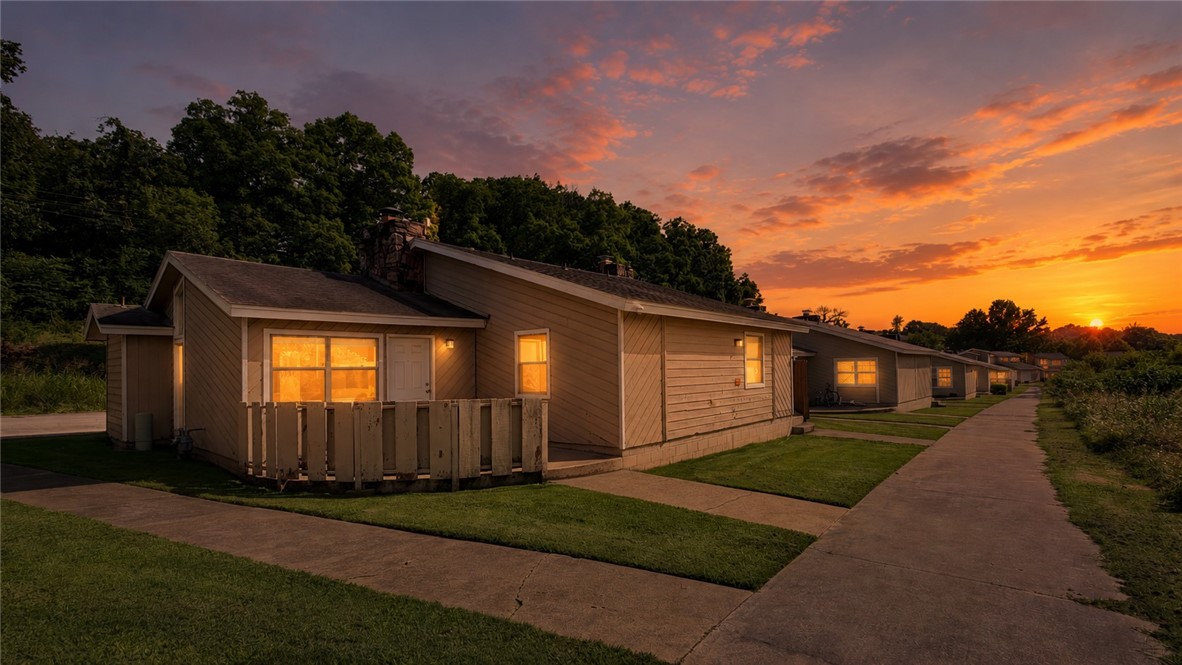 This wonderfully affordable one-level condo with two full bathrooms features an open concept living room filled with natural light and a rustic stone fireplace reminding you that you're in the Ozarks.  Front bedroom has a private bathroom with full laundry for your convenience. Large flex space includes a skylight and attached full bathroom.  All appliances convey, washer/dryer and refrigerator included.  Absolutely can be occupied as is, but this could be an incredible opportunity for sweat equity as it is priced with its mostly original condition in mind allowing room for improvements.  If you're looking to add to your portfolio similar units recently leased for $1050/mo.  All room measurements are approximate and should be verified by the Buyer. Inspections welcome, seller will not do repairs.