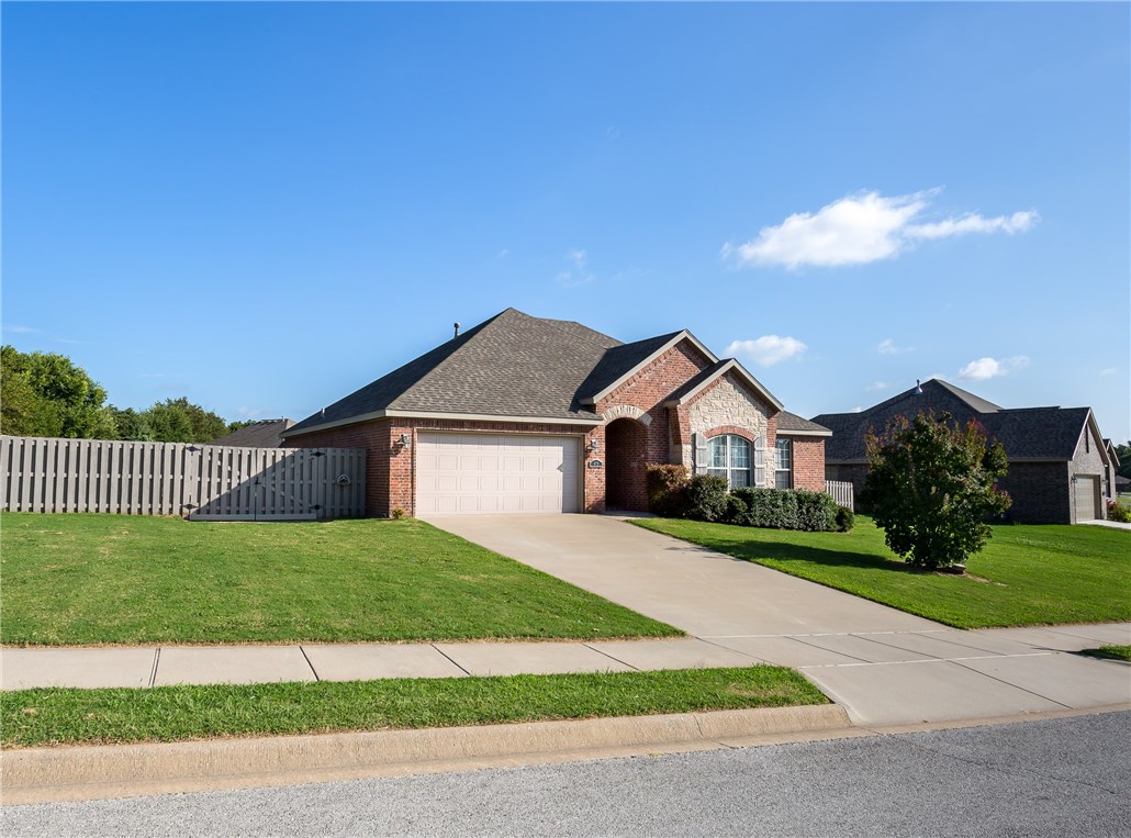 Beautiful brick home located in nice neighborhood! Archway entrance welcomes you to open living room w/10 ft ceilings, custom crown molding & fireplace. Wood floors in living area, hall & master bd, kitchen has beautiful wood cabinets, stainless appliances, granite counters, & pantry.Master suite includes 2 sinks/vanities, walk in shower, whirlpool tub & 2 lg closets.Covered patio. Better than new construction w/window coverings, landscaping, privacy fenced backyard,& storage building w/open storage area!