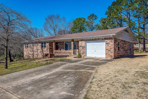 Very well maintained brick home on a dead end street. In last 5 yrs NEW items include: roof, windows, carpet, fridge, dishwasher, & stove. Also main plumbing replaced, insulation added in interior wall of semi-finished basement garage, 6'' insulation blown in attic with pull down stairs and partial flooring for storage. Nice den/man cave finished in basement. Part of basement is heated. Storage bldg, large garden area & a 10x30 deck. One garage is on main level and the other is in basement. Garage in basement is 14x38 and perfect for auto work.Sq ft per assessor. All #'s approximate. Taxes are after Homestead credit.