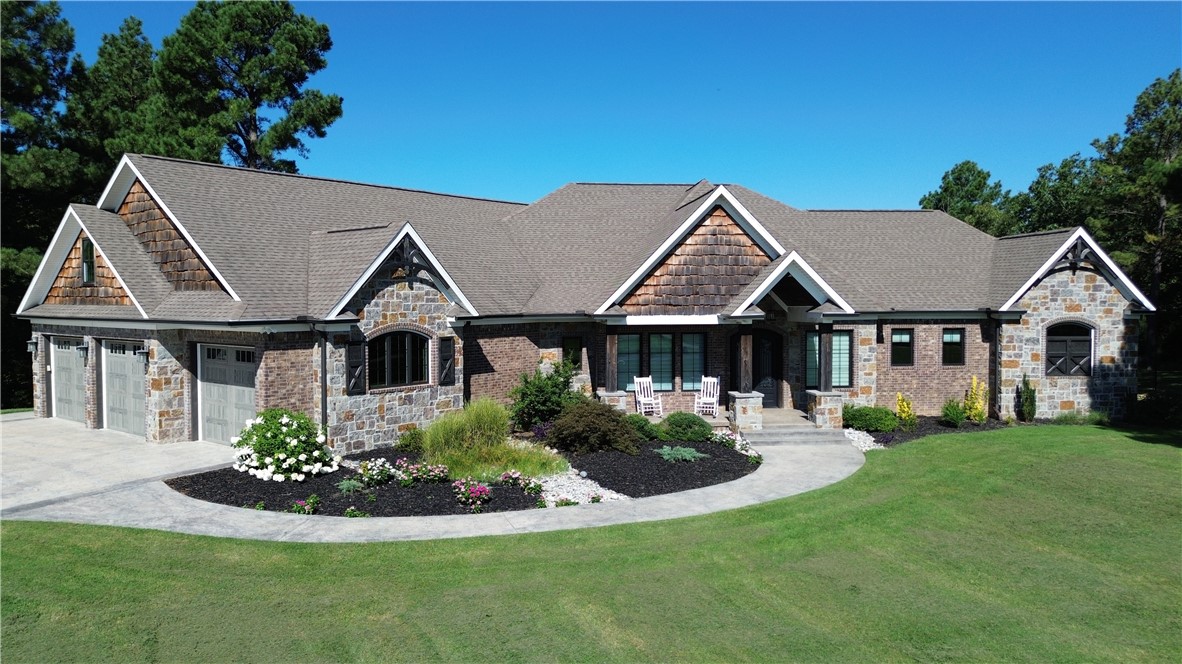 If you are looking for a home that has it all, look no further. This custom built home was made for luxury,
comfort, and energy efficiency. From top to bottom, there is not a detail that was spared in this gorgeous
home. With over 6500sf, this stunner boasts 8 Bedrooms, 4 full bathrooms, 2 half bathrooms, 2 living
spaces, sun room, media room wired for a projector, 2 kitchens, outdoor kitchen, safe room, and with almost 5 acres.....This home really has it all. Energy Efficiency in a home of this size is almost unheard of, but not for this home!!!! A full list of features is in the photos and attachments. Just inside of Huntsville city limits and 25 mins from Fayetteville, 20 mins from Springdale, & 35 mins to Downtown Rogers.....this home is perfect for those who want some privacy but also want to be close enough to all of the happening  things in NWA!!!