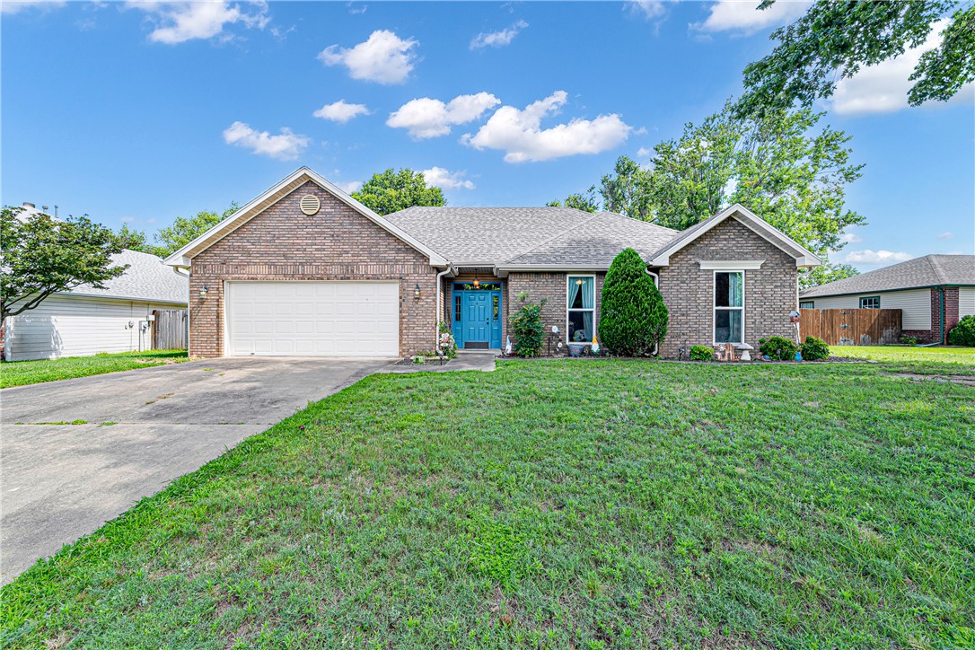 Beautifully remodeled ranch home in the heart of Bentonville, easy distance to Orchards Park, Crystal Bridges Museum, and the area's scenic trails! This 3-bedroom, 2-bath home has been thoughtfully updated with crown molding, trayed ceilings, wood floors, and fresh paint throughout. The eat-in kitchen features granite counters, while the primary suite impresses with double sinks, a spacious walk-in closet, and heated floors in the ensuite bath—a true retreat. A wood-burning fireplace warms the inviting living room, and the eat-in kitchen makes everyday living easy. Step outside to an awesome backyard built for entertaining: a large patio and full wood privacy fencing create the perfect setting for gatherings or quiet evenings alike. Additional features include a 2-car attached garage, attic storage, and a level, landscaped lot on a curbed street in the desirable Ivy Place subdivision. This home is in immaculate condition and ready for its next owner. Don't miss it!