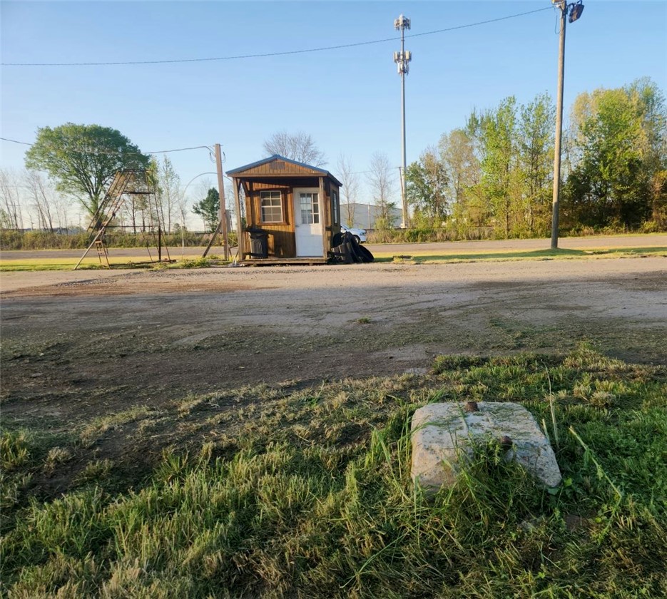 Prime highway frontage property featuring tractor-trailer washout capabilities, truck storage, and an easy-to-maintain setup.  Great location for trucking operations, business use, or investment opportunity.