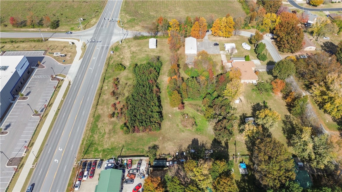 Prime commercial opportunity in one of Northwest Arkansas’ fastest-growing corridors. Located just off I-49 at 626 Oakwood St in Lowell, this level and build-ready parcel offers excellent visibility and easyaccess for a variety of business uses. Surrounded by established commercial development, distributioncenters, and residential neighborhoods, the location provides strong traffic flow and consistent growthmomentum. Whether you’re looking to develop office, retail, service-based business, or investmentproperty, this site offers the flexibility to bring your plans to life. Utilities available. Close proximity to JBHunt headquarters, restaurants, hotel accommodations, and key regional business hubs. A strategiclocation in the heart of NWA’s economic expansion. Bring your vision and build where the growth is happening