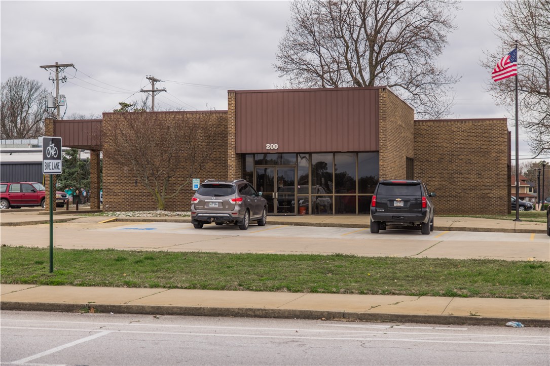 3732 sqft of commercial space for lease in the heart of Downtown Springdale. Excellent visibility on corner lot with frontage on Holcomb St, Meadow Ave, and Main St. Building has a drive-through with awning and is on a 0.64-acre lot with greenspace & large shade trees, 2 monument signs with poles, and private parking lot with 27 designated spots. There are also 2 public lots across the street for additional parking needs. Property is one block off Emma Ave, 0.1 miles from Razorback Regional Greenway bike trail, is situated in downtown's Arts District and adjacent to the Outdoor Dining District. Building has double door main entrance, large open area, conference room, 2 offices, breakroom, 2 bathrooms, laundry hookups, back entrance and former bank vault that can serve as a storage room. This building would make a wonderful restaurant, retail space, coffee shop, production studio, office, gallery and more. This is your chance to get in and be a part of the excitement in Downtown Springdale.
