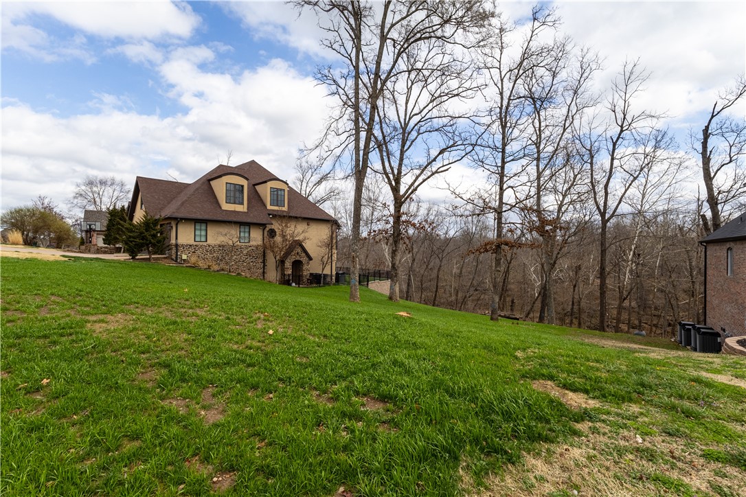 RARE OPPORTUNITY to build in the highly sought after Chapel Hill neighborhood. This is the last available lot on Chapel Hill Drive, offering a unique chance to build in an established community located just 5 minutes from the Walmart Home Office Campus and less than 2 miles from Downtown Bentonville. 

This beautiful lot backs up to peaceful woods and a natural creek, providing privacy and a scenic natural backdrop. Residents can enjoy easy access to world-class mountain biking trails, dining, and local attractions, including Crystal Bridges Museum of American Art just minutes away.

Don't miss your chance to build your dream home in one of Bentonville's most desirable neighborhoods!