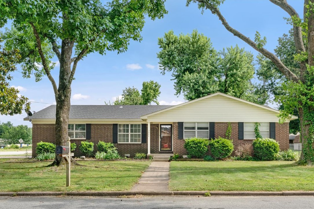 Rare opportunity in the heart of Bentonville's booming growth corridor! Located on the corner of Moberly and SE 15th Street and just minutes from the new Walmart Home Office campus, downtown Bentonville, and some of Northwest Arkansas' most desirable amenities.  With easy access to I-49, this property offers unmatched convenience and investment potential. Situated on a large corner lot, the home features 3 bedrooms, 2 baths, a spacious living area with fireplace.  With Bentonville continuing to experience tremendous growth, properties in this area remain in high demand. Ideal for owner-occupants, investors, or anyone wanting to be close to the center of Bentonville's continued expansion.  Whether you're looking for a primary residence, rental investment, or long-term hold in a rapidly appreciating area, this location is hard to beat. Enjoy the convenience of living near Bentonville's premier employment, recreation, biking, and entertainment destinations while still having the comfort of an established neighborhood.