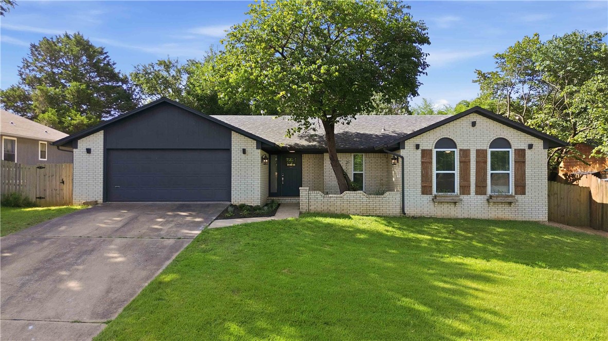 If you've been looking for a home in East Fayetteville, this location is hard to beat! Just a short walk to Gulley Park and the Razorback Greenway, you'll love having one of Fayetteville's favorite parks, walking trails, and playgrounds practically in your backyard. Inside, you'll find 3 bedrooms, 2 bathrooms, and a spacious, open layout that's easy to live in. The living room, dining area, and kitchen all flow together, making it a great space for entertaining or just everyday life. Out back, the fully fenced yard and covered patio are perfect for grilling, letting kids and pets play, or enjoying your morning coffee. The two-car garage even includes a 220V outlet for EV charging. Beyond the neighborhood, you're just minutes from shopping, restaurants, schools, the University of Arkansas, and everything Fayetteville has to offer! Well-maintained, move-in ready homes this close to Gulley Park at this price don't come along often. Schedule your showing before it's gone!